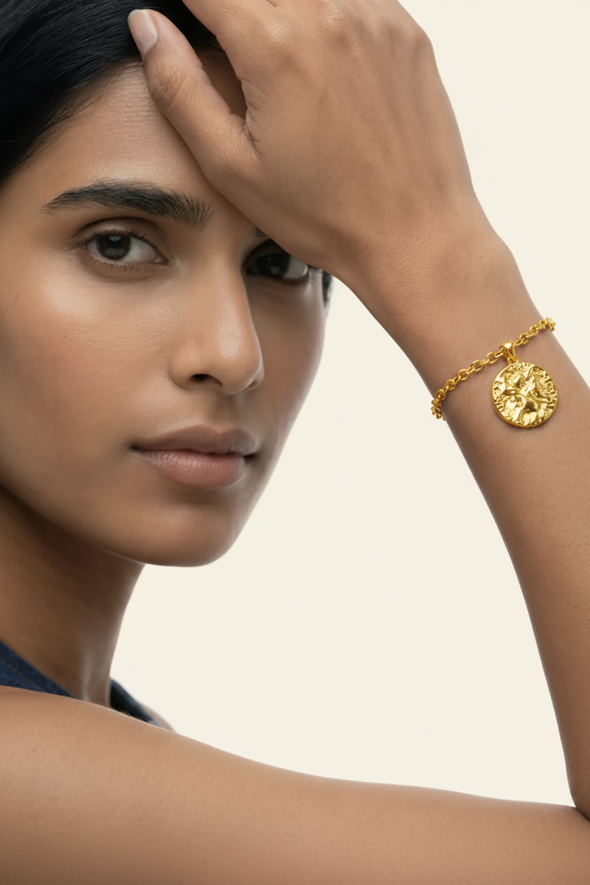 Lumière Medallion Charm Bracelet – Gold, model wrist close-up